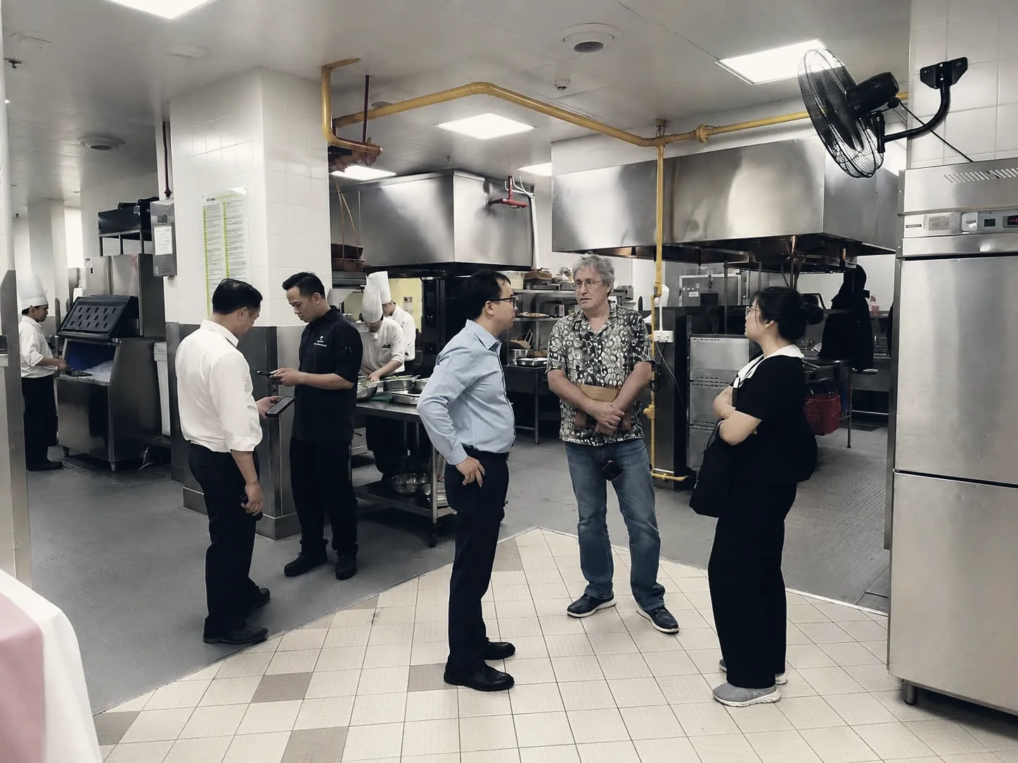 Hotel kitchen with stainless steel hoods during a site survey